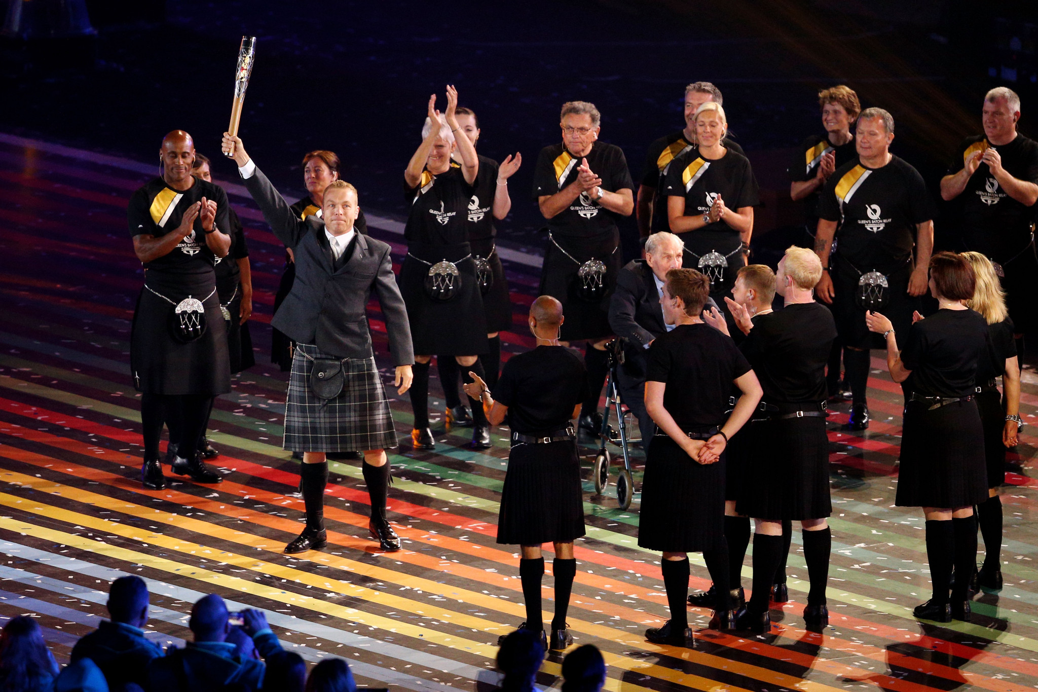 Sir Chris Hoy holds up the baton during the Opening Ceremony for the Glasgow 2014 Commonwealth Games at Celtic Park on July 23, 2014 ©Getty Images